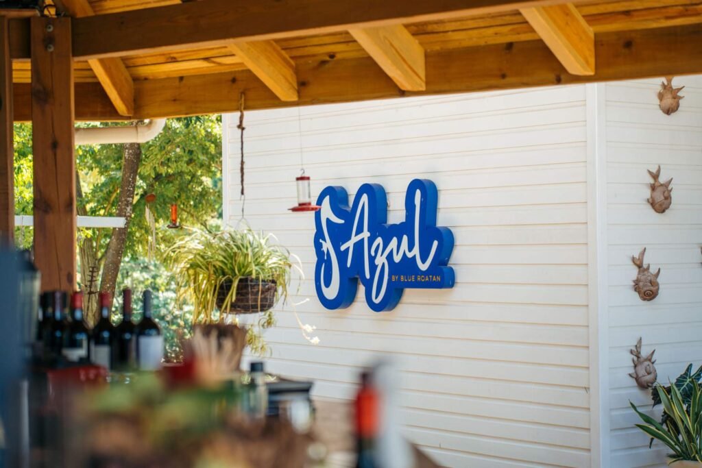 Azul Restaurant sign and bar at Blue Roatan Resort