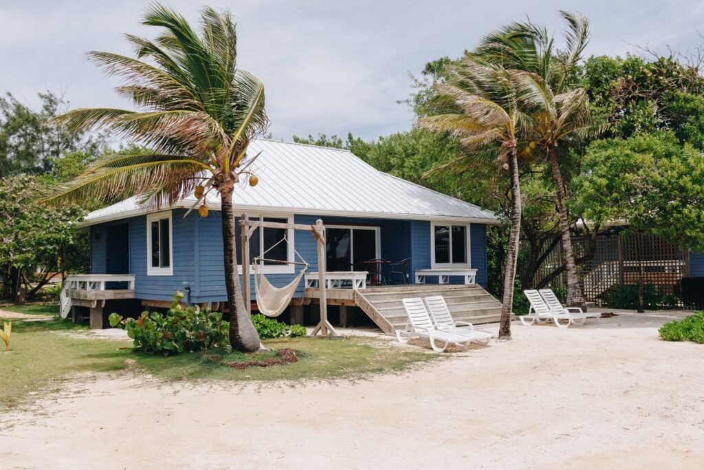 Blue guest villa and hammock at Barefoot Cay Resort & Marina
