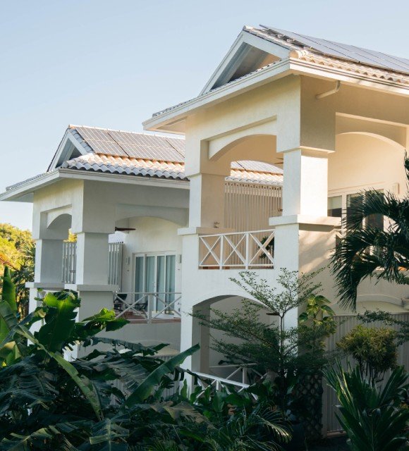 Guest accommodation and tropical gardens at Blue Roatan Resort