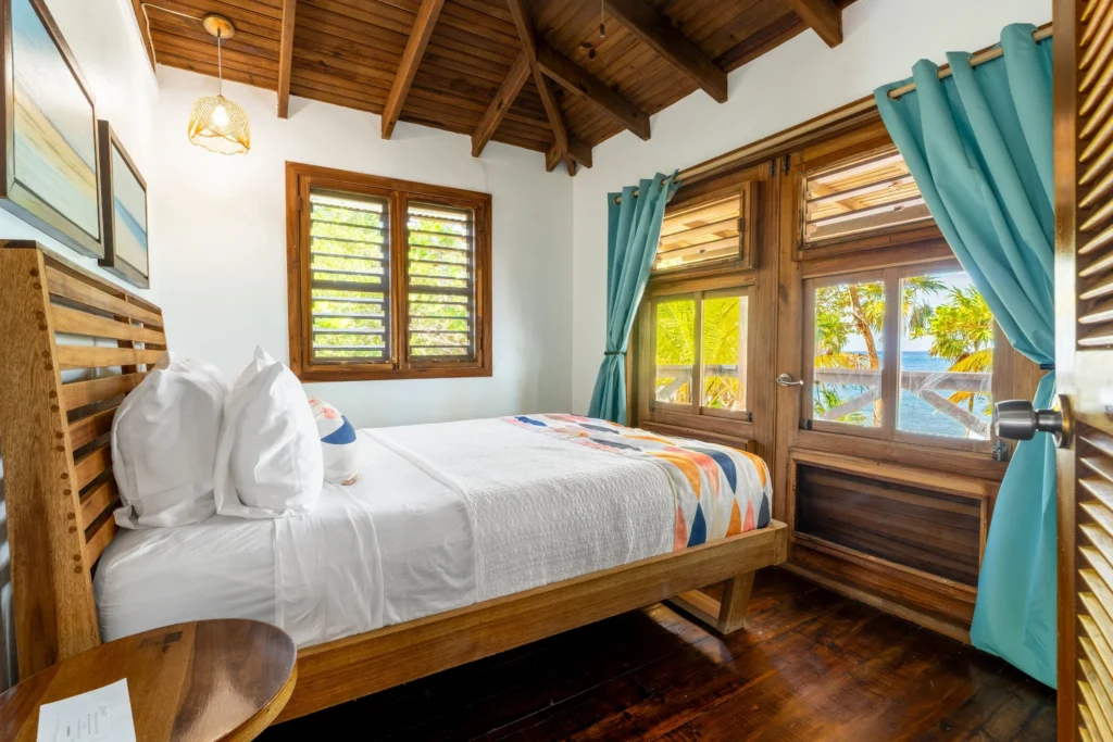 Guest room with wooden furnishings at Camp Bay Lodge